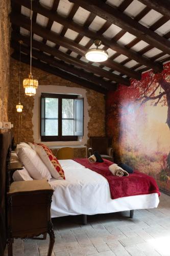 a bedroom with a large bed in a room at Can marques in Cunit