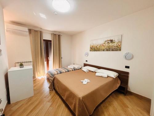 a bedroom with a bed and a couch at Guest Room 144 in San Giovanni in Fiore
