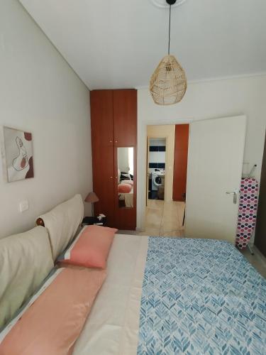 a bedroom with a large bed and a couch at Margerita in Mytilene