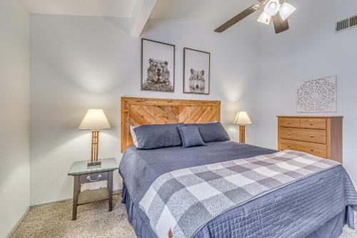 a bedroom with a bed and a ceiling fan at Hike, Golf & Explore: Ruidoso Retreat w/ Deck! in Ruidoso