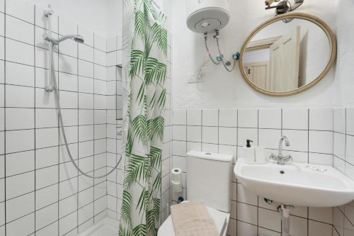 a bathroom with a shower and a sink and a mirror at Casa Veronica in Arona