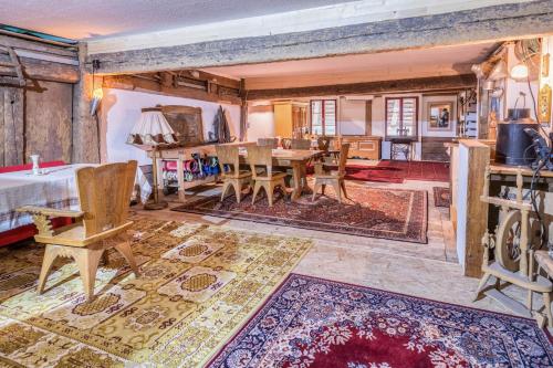 a living room with a table and chairs at Schwörerhof in Eisenbach