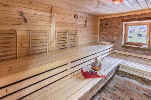 a wooden sauna with a bench in a cabin at Schwörerhof in Eisenbach
