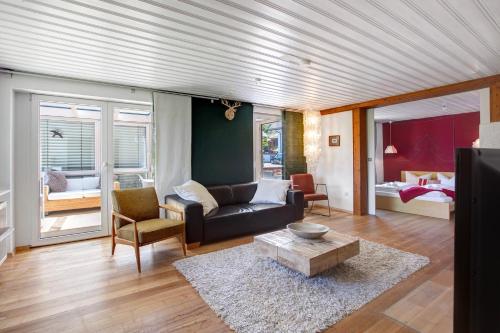 a living room with a couch and a table at Haslehaus in Feldberg