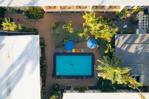 an overhead view of a garden with a large screen tv at Waikiki Heritage Hotel in Honolulu