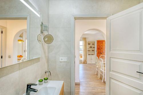 a kitchen with a sink and a mirror at Chalet Irene by dracmallorca in Santanyi