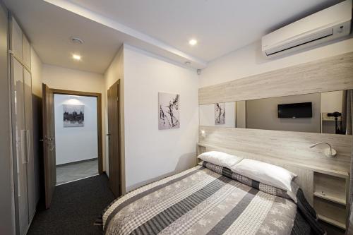 Postel nebo postele na pokoji v ubytování Hotel Sacvoyage