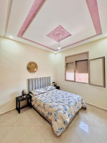 a bedroom with a bed in a room at Mhamid 4 in Marrakesh