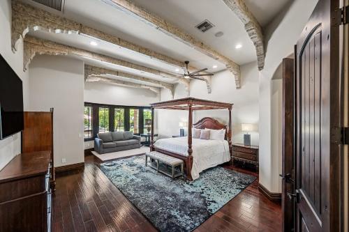 a bedroom with a canopy bed and a living room at 104th Mesa 1331 Paradise Found in Mesa
