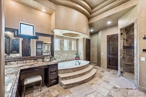 a large bathroom with a tub and a sink at 104th Mesa 1331 Paradise Found in Mesa