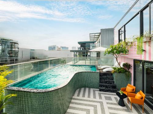 a swimming pool on the roof of a building at Minasi Grand Hotel in Hanoi