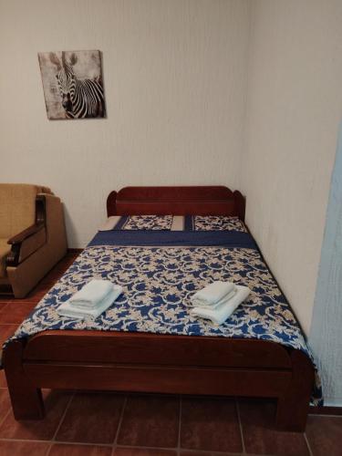a bed in a room with two napkins on it at Apartmani Medo in Risan