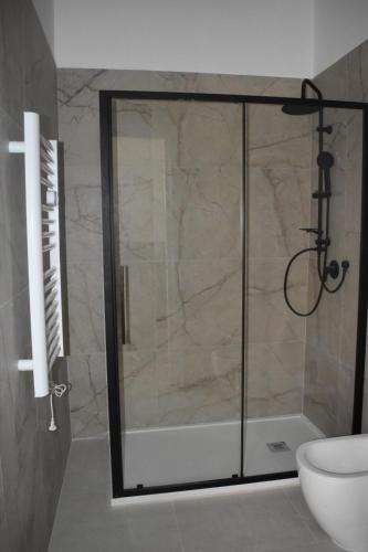 a shower with a glass door in a bathroom at Terrazza sul Borgo in Polignano a Mare