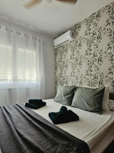 a bed with two pillows on it in a bedroom at Casa Ariño Ruidera in Ruidera
