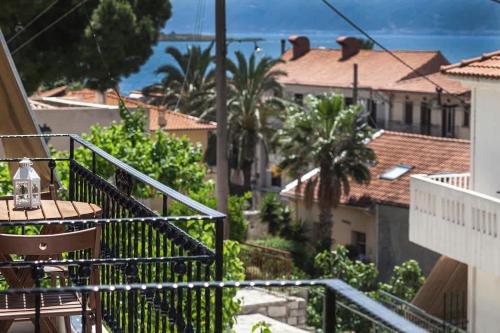 a view of a city from a balcony at Lithos House & Spa in Nafpaktos