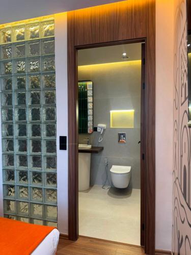 a room with a bathroom with a toilet and a sink at Le M Neo in Rabat
