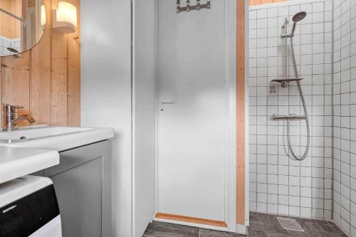 a bathroom with a shower and a sink at C11267-Hemmet-Egernvej-12 in Henne Strand