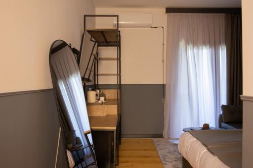 a bedroom with a bunk bed and a room with a window at Lake side Dilijan in Dilijan