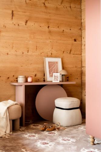 a table and a stool in a room with a desk at Owca na Polanie in Zakopane