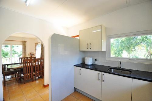 Η κουζίνα ή μικρή κουζίνα στο GT Self Catering Apartments