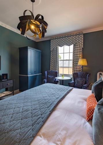a bedroom with a large bed and a window at Ansty Hall in Coventry