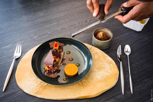 a plate of food on top of a table at Simon Hotel in Fort-de-France