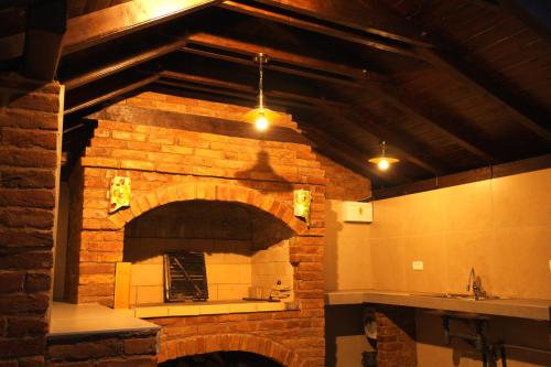 a large brick oven in a kitchen with a counter at Lady Wine in Plešivica