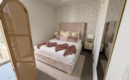 a bedroom with a bed and a large mirror at CD1608 Downtown Loft with Pool a Gym and City Views in Miami in Miami
