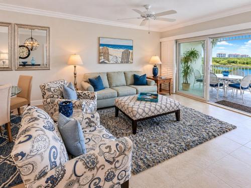 a living room with a couch and a table at Old Marco Inne 403 in Marco Island
