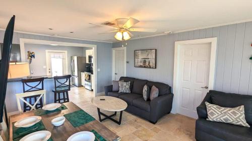 a living room with a couch and a table at 213 Ohio in Fort Myers Beach