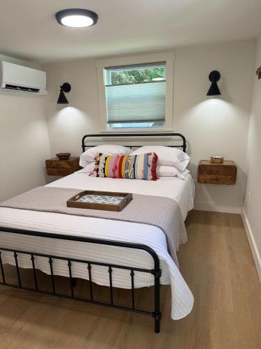 a bedroom with a large bed with a window at Sunapee Getaway With Lake Access in Sunapee