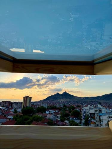 a view of a city from a window at COSMOS Panorama Apartments in Prilep