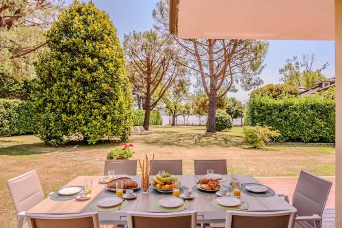 a table with food on it in a garden at Villa Lago Maggiore in Lesa