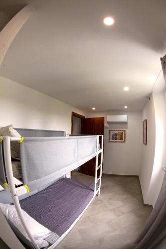 a room with a bunk bed and a staircase at A Casa di Gaia 2 in San Benedetto
