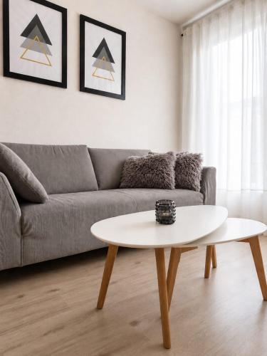 a living room with a couch and a coffee table at Apartmán Hestia 5 in Rajecké Teplice
