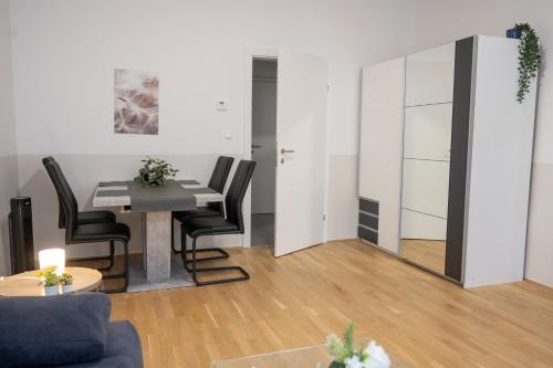 a living room with a table and chairs at Paky Appartements 00209 in Vienna