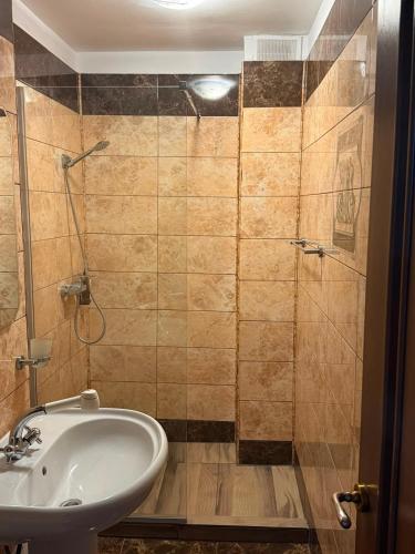 a bathroom with a sink and a shower at Hotel Atlantic Costinesti in Costinesti