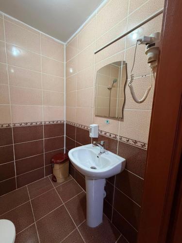 a bathroom with a sink and a mirror at Grand Bazaar Hotel Merve in Istanbul