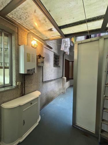 a bathroom with a tub and a sink and a window at Apartamento en A Coruña in A Coruña