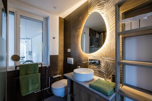 a bathroom with a sink and a mirror at Un Occhio Sul Lago in Dormelletto