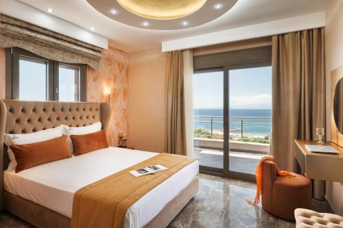 a bedroom with a bed with a view of the ocean at Aphrodite of Thassos in Skala Marion