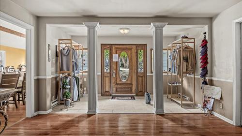 a hallway with a door and a dining room with at Black Bear Manor in Ouray