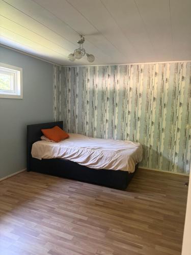 a bedroom with a bed in a room at Omran House in Ystad