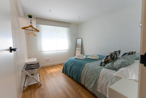 a bedroom with a bed and a window at LAR DE SEFA in Redondela