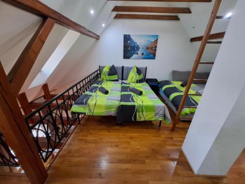 a bedroom with two beds and a staircase at GR ooms-Rents in Gemmrigheim