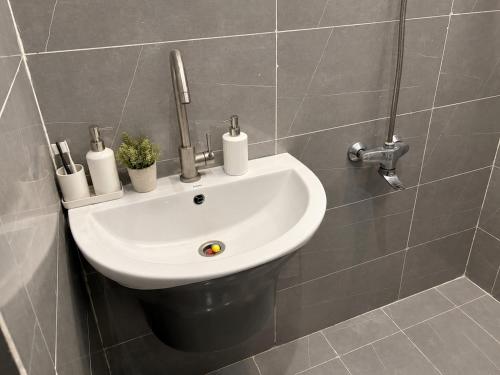 a bathroom with a sink in a wall at شقه فندقه in Hail