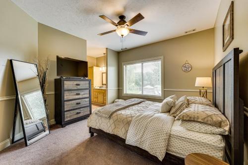 a bedroom with a bed and a ceiling fan at Private Getaway! Massive Springfield Area Home in Rogersville