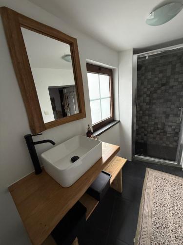 a bathroom with a white sink and a mirror at Casa D Matilde in Góis