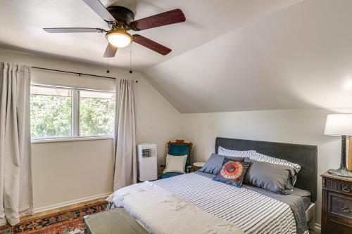 a bedroom with a bed and a ceiling fan at Walk to Downtown Chico! Tree-Lined Apt w/ Deck in Chico