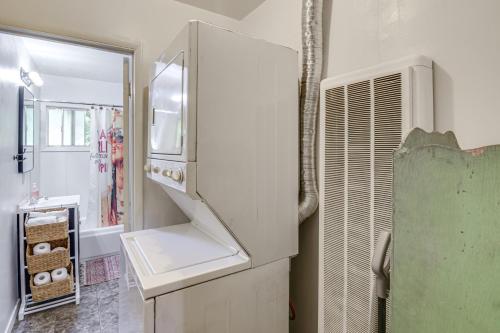 a kitchen with a refrigerator and a sink at Walk to Downtown Chico! Tree-Lined Apt w/ Deck in Chico